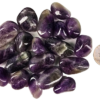A pile of large amethyst tumbled stones with deep purple, to violet hues, and some white patterns, with a quarter for comparison. Some are smaller than the quarter, and some the samdiameter or larger.