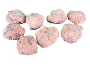 Unopened crystalline geodes that have a redish, and purple tint.