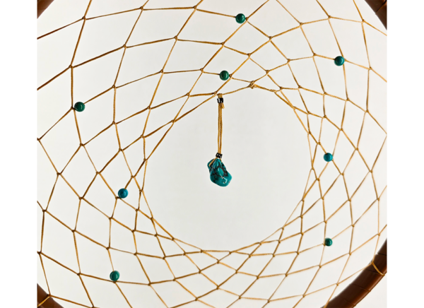 A closeup of a turquoise chunk and beads woven into a dream catcher.