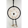A black dream catcher with a chunk of tiger's eye as the centerpiece, with smaller stones woven around the center, and draped with feathers.