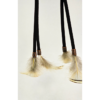 Feathers hanging from a dream catcher held on by copper beads.