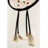 Feathers hanging from a dream catcher held on by copper beads.