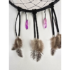 The bottom of a dream catcher showing it is draped with two purple quartz crystals, and feathers held on with silver beads.