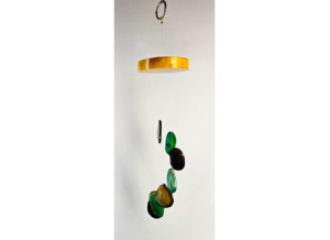 An agate windchime with a polished wood base strung with black and green agate slices.