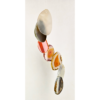 A closeup of multicolored agate slices hanging from a windchime.