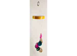 A multicolored agate windchime with a stained wood base.