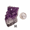 Amethyst cluster 'M' with a quarter for comparison.