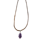A shot of an amethyst point pendant including the wax cord adjustable necklace it comes with.
