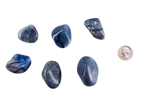 Large tumbled blue quartz stone in soft shades of sky blue with subtle marbling, shown next to a quarter for size comparison, the stones are larger than the quarter.
