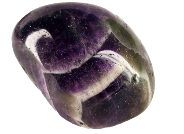 A closeup of medium chevron amethyst polished stone, with deep purple to violet, with white in chevron patterns on the stone.
