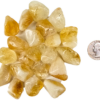 A pile of small tumbled citrine, with a light hone color, with some milky white, and translucency to the stones, with a quarter for comparison. All are slightly smaller than the quarter.