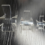 Three different acrylic slab display stands.
