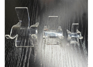 Three different acrylic slab display stands.