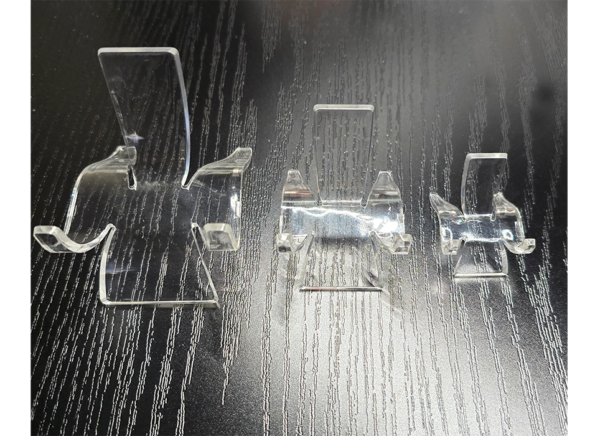 Three different acrylic slab display stands.