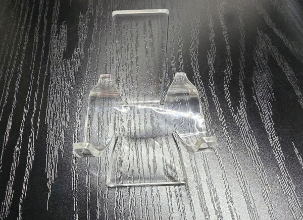 A large acrylic slab display stand.