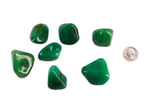 Alt text: Large tumbled Green Aventurine stones with smooth, polished surfaces and natural green hues, displayed on a neutral background.