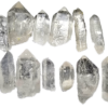 A group of twelve quartz crystal points.