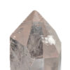 Closeup of a large clear quartz point showing a small ding on the face of a point from mining.