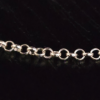 A closeup of the rolo chain on the sterling silver adjustable necklace.