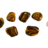 Large A Grade Tiger's Eye tumbled stones with smooth, polished surfaces showcasing rich golden-brown hues and a captivating chatoyancy shimmer, compared to the size of a quarter, it is larger.