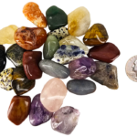 A pile of tumbled mix with a range of small stones with a quarter for comparison. Most are slightly smaller than the quarter.