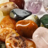 A closup of pile of tumbled mix with a range of small stones.