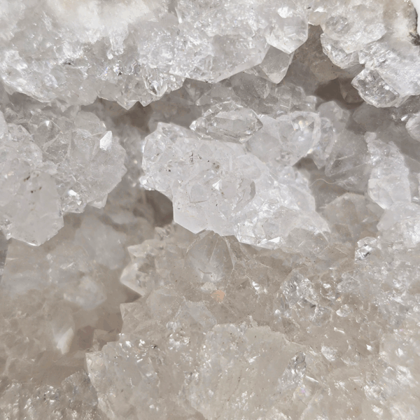 A shot of the interior of an extra large hollow Moroccan geode showcasing the amazing quartz crystals inside.