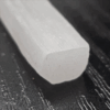A closeup of a selenite stick end.