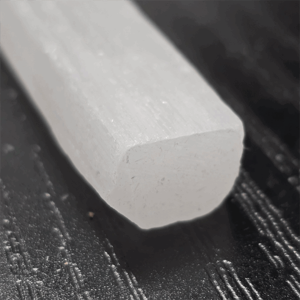 A closeup of a selenite stick end.