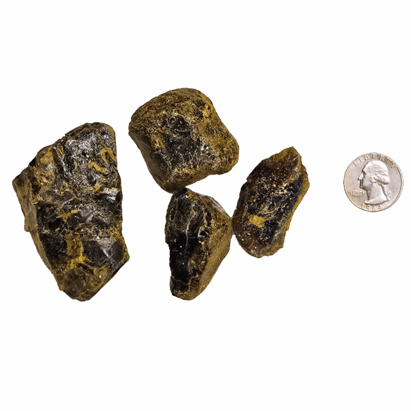 A quarter pound of Indonesian golden brown amber, with a quarter for size comparison.