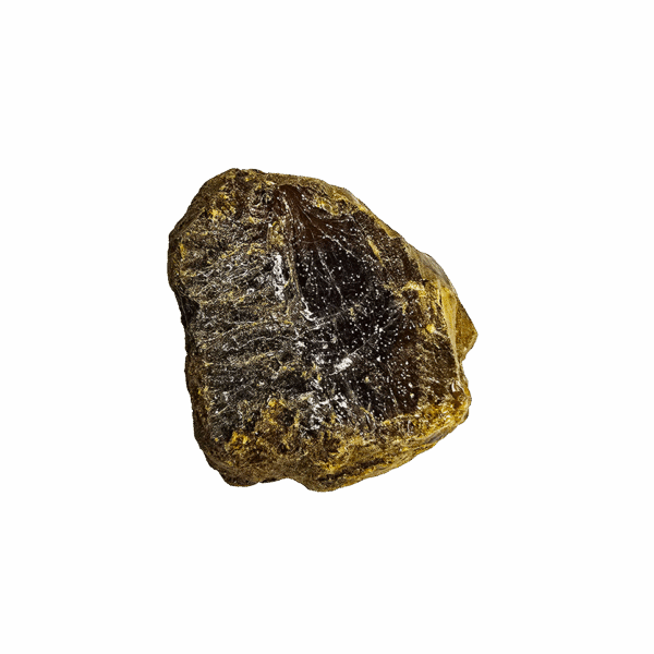 A closeup of a chunk of golden brown Indonesian Amber.