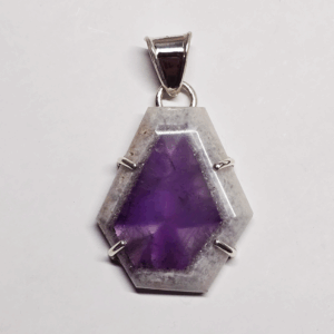 Atomic amethyst pendant with sterling silver posts securing stone, and a bail.