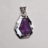 Back of atomic amethyst pendant with sterling silver backing, and a bail.