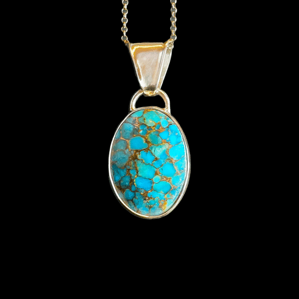 Sterling silver turquoise pendant with copper matrix.